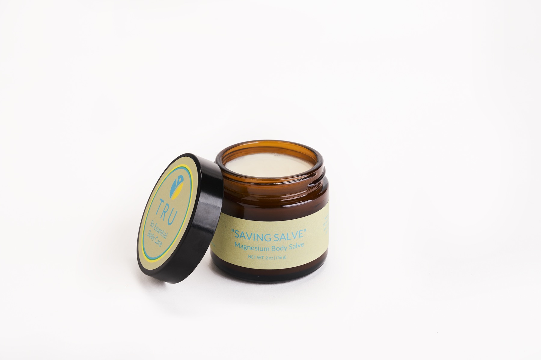 Saving Salve magnesium body salve in an amber glass jar