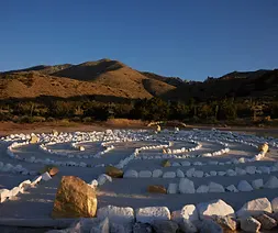 Stone labyrinth set into a mountain retreat landscape