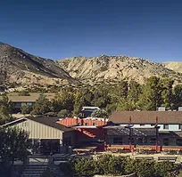 Mountain and ranch buildings seen across the retreat property